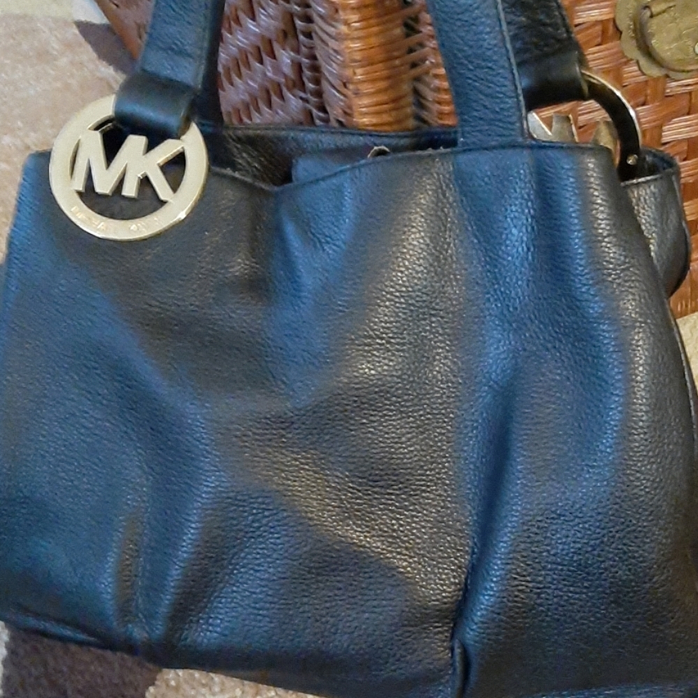 MK purse with MK hard ware on both straps